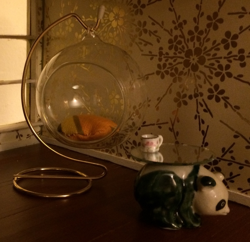 Panda figurine and some mirrors. Photo by Holly Tierney-Bedord. All rights reserved.